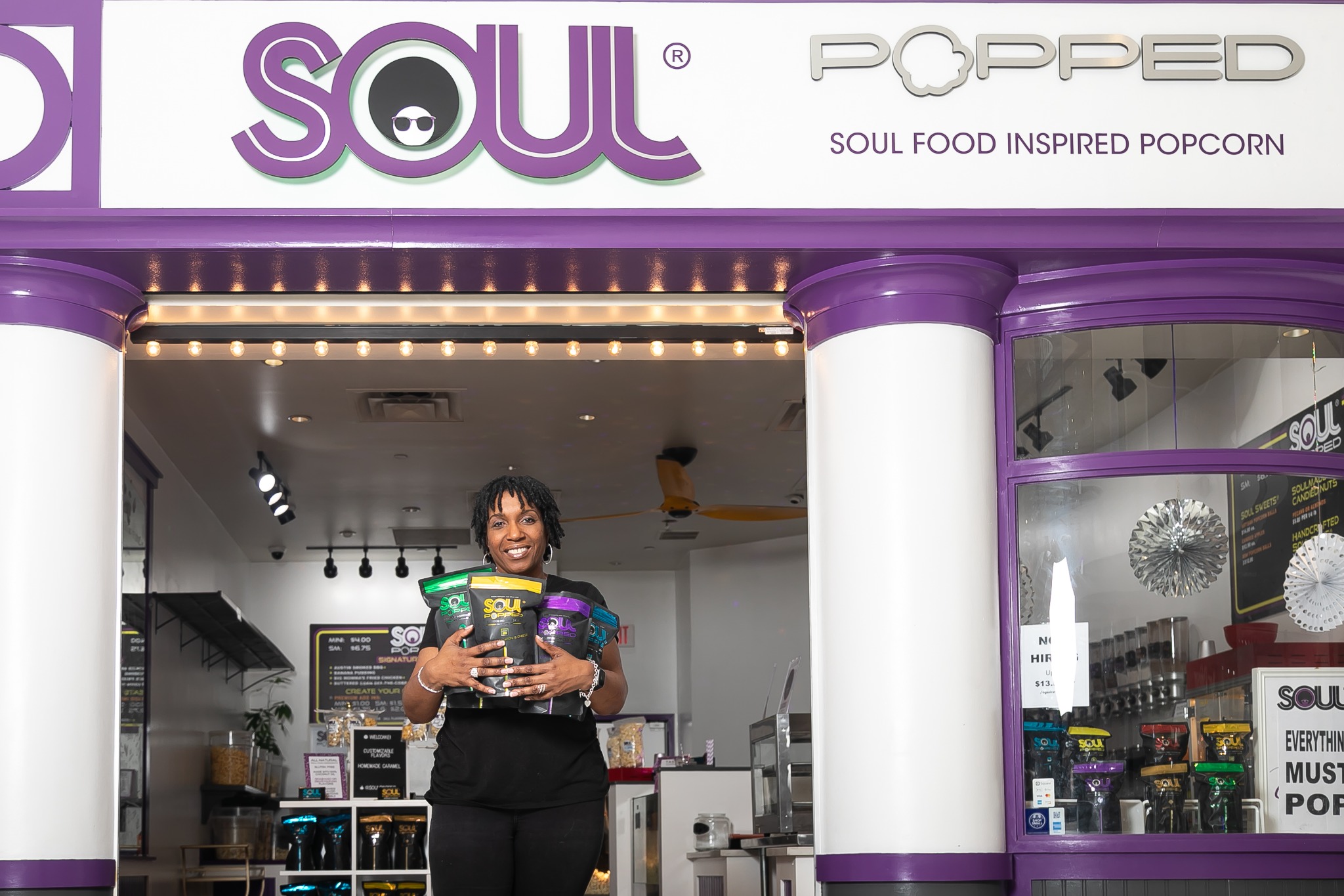 De J. Lozada at her Soul Popped business storefront